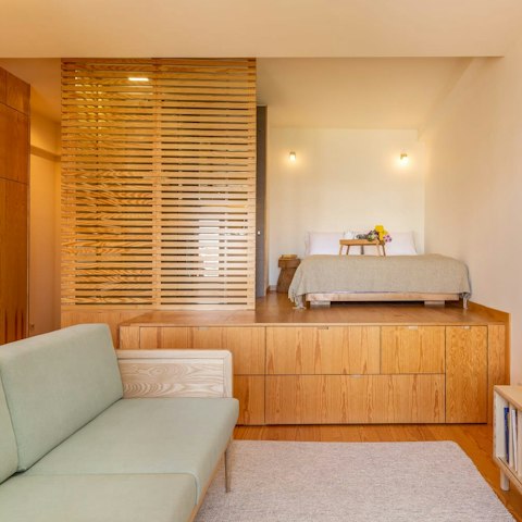 Make yourself at home in this stylish studio after exploring the city, complete with a small kitchenette and a raised bedroom area