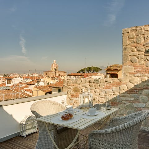 Dine alfresco on the rooftop terrace with sweeping views of Florence