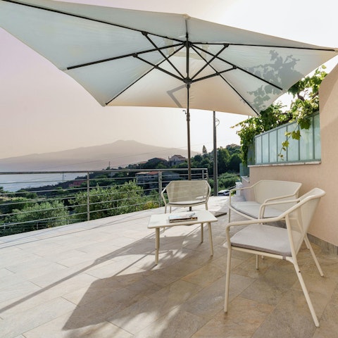 Sip cocktails on the terrace as the sun dips below the Ionian Sea