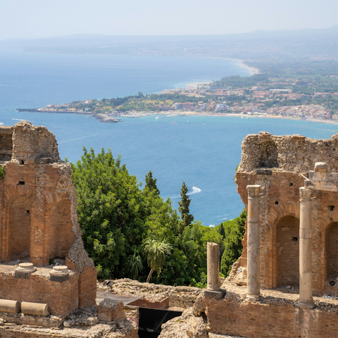 Browse the boutiques and ancient ruins of Taormina, just a short drive away