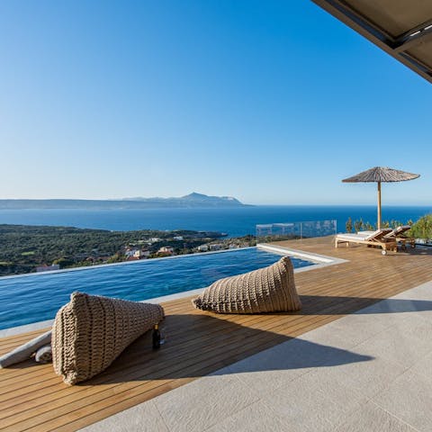 Admire stunning views of the bay of Chania from the poolside