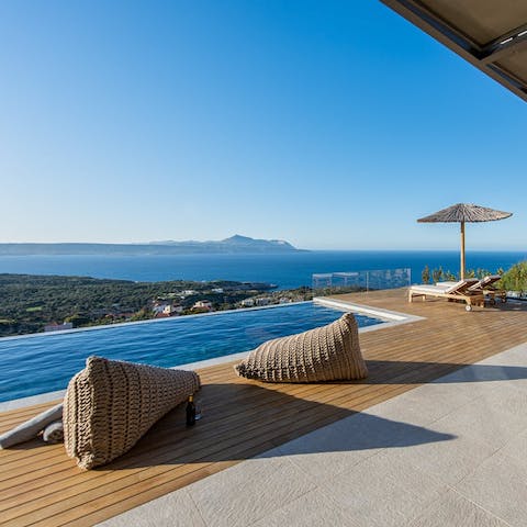 Admire stunning views of the bay of Chania from the poolside
