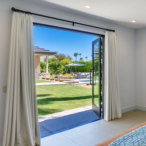 Gaze out at the gardens, pool and hot tub from the comfort of your bed