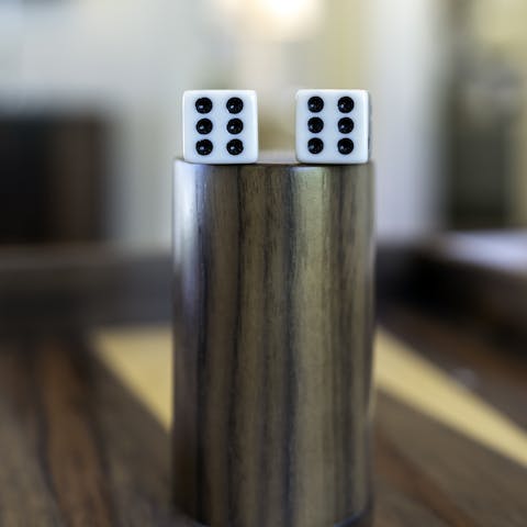 Challenge friends and family to a backgammon tournament at the games table