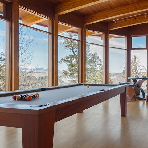 Set up a game of pool in the entertainment room