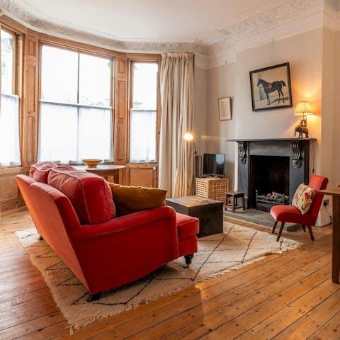 Relax on the sofa with a book from your host's collection