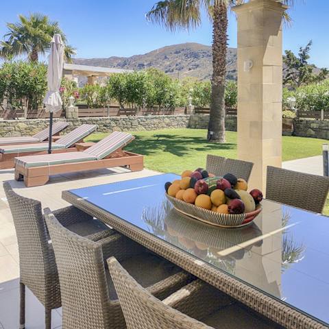 Gaze out at the Cretan mountains as you dine alfresco