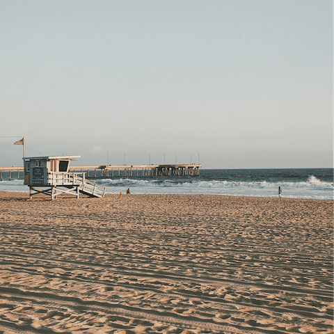 Walk the powdery sands of Venice Beach, a twenty-minute drive away