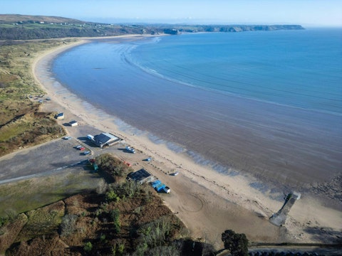 Explore Oxwich Bay's sweeping golden sands and sheltered dunes