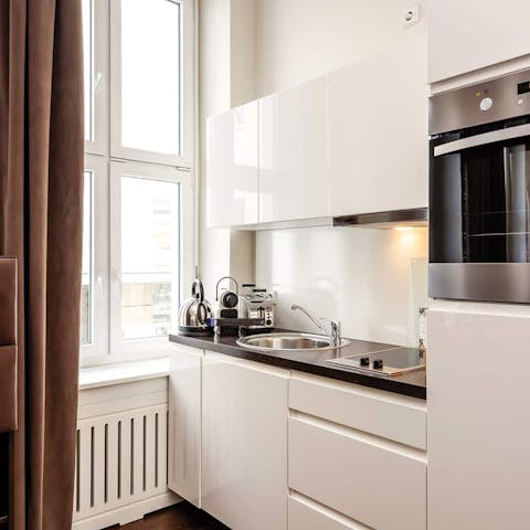 Fire up the coffee pod machine in the sleek kitchen area