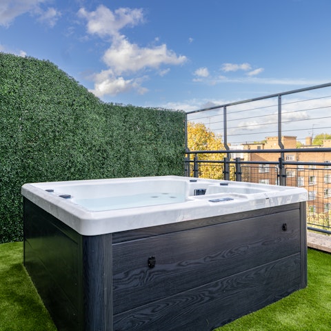 Wind down with a soak in the hot tub under the stars