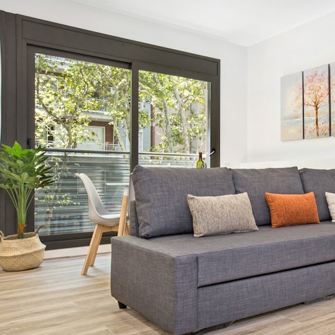 Peer over the balcony to the bustling streets as you sip your morning espresso