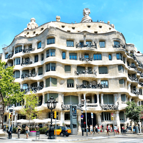 Take the metro twenty minutes to visit the striking Casa Milà