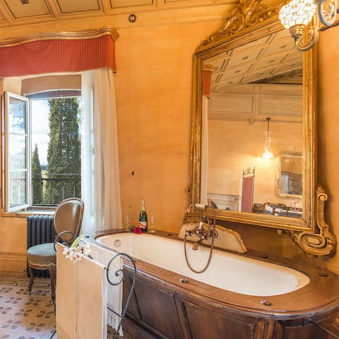 Take a relaxing soak in the tub in the bedroom