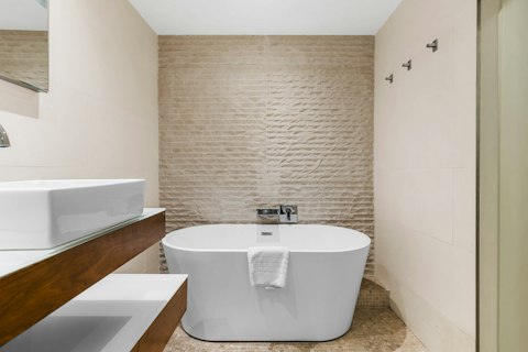 Soak in the freestanding bathtub after a long day exploring