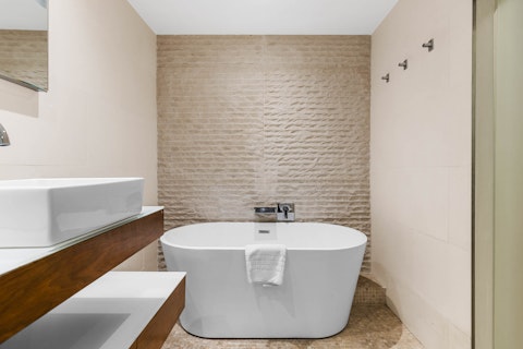 Soak in the freestanding bathtub after a long day exploring
