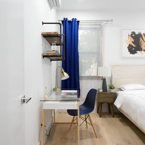 Catch up on work at the bedroom's study desk space