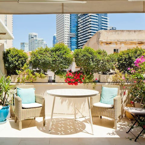 Enjoy your morning coffee on your lusciously floral roof terrace