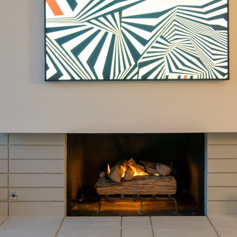Get cosy in front of the fireplace