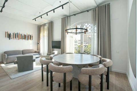 Gather with friends around the chic circular dining table for meals