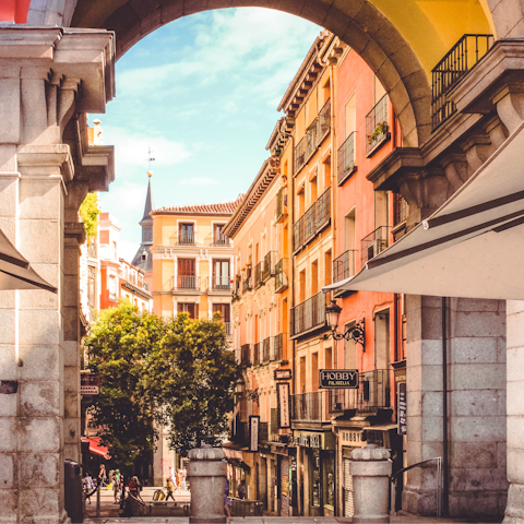 Enjoy a cold beer at one of Plaza Mayor's cafes, just five minutes on foot
