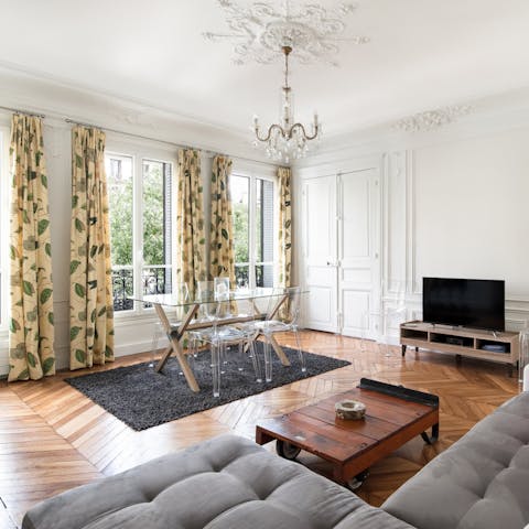 Sip red wine under the chandelier before heading out to dinner