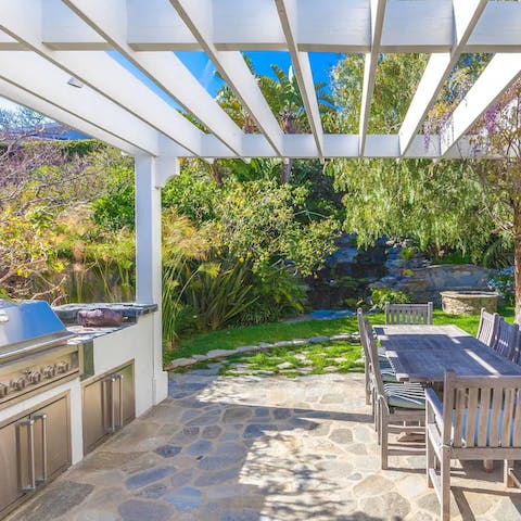Cook up some American style hotdogs and burgers at the outdoor kitchen and barbecue area