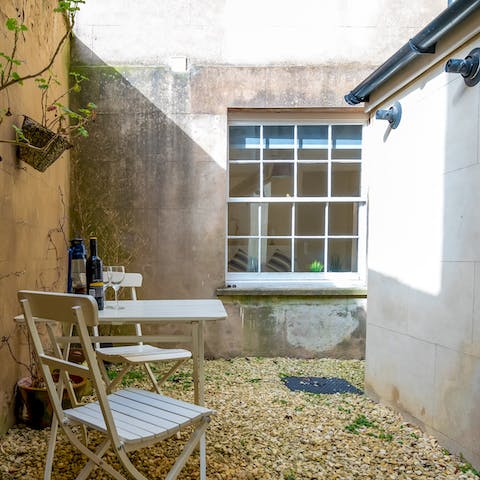 Pop open something sparkly and enjoy in the private courtyard