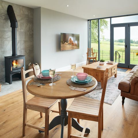 Cosy up by the living room's fire after a day of hiking