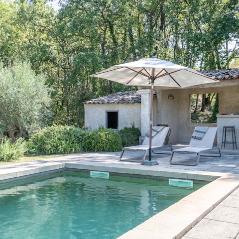 Sprawl out on a poolside lounge chair and soak up the sun