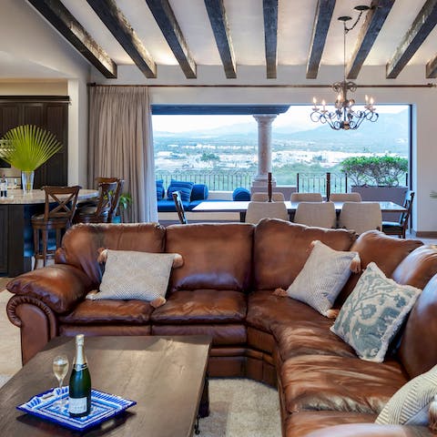 Fall back into your comfy leather couch after a long day on the beach