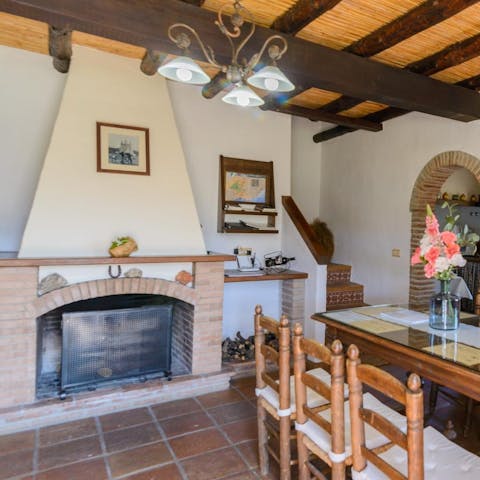 Light the fire and socialise over a cup of coffee at the dining table