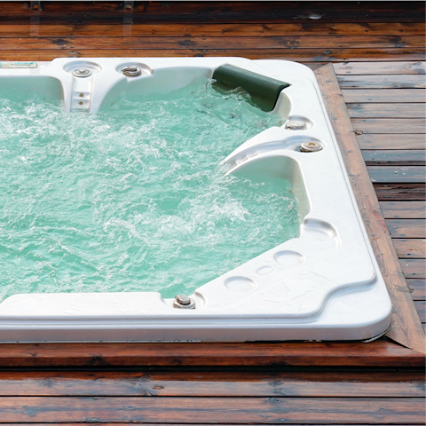 Relax in the hot tub after a busy day exploring the coast