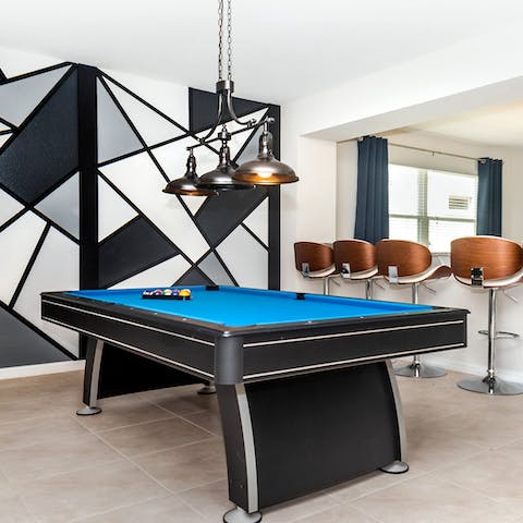 Pick stripes or solids, then play a tournament on the pool table