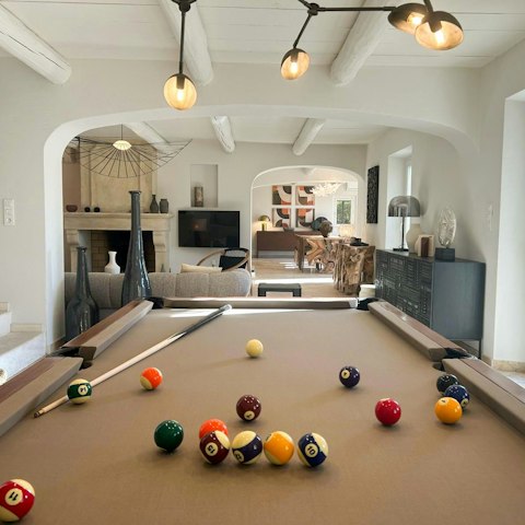Play a game of pool before sitting down to a French-inspired supper