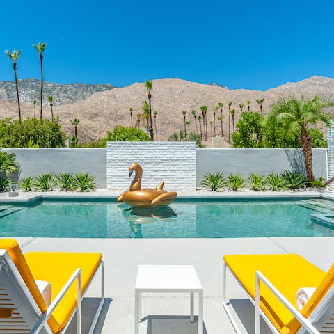 Relax in the sun by the glittering pool