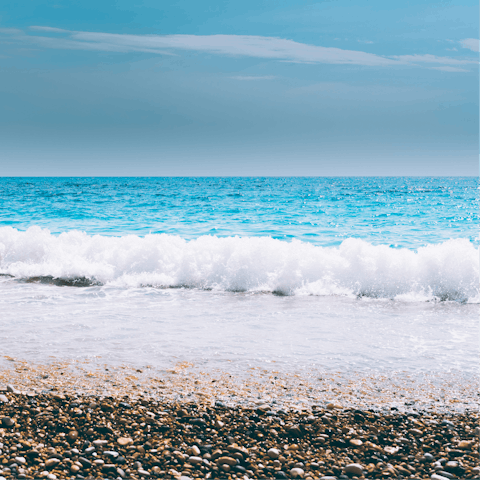 Drive down to Perivolakia Beach and picnic on the pebbles