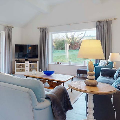 Relax in the cosy lounge and enjoy views of the gardens