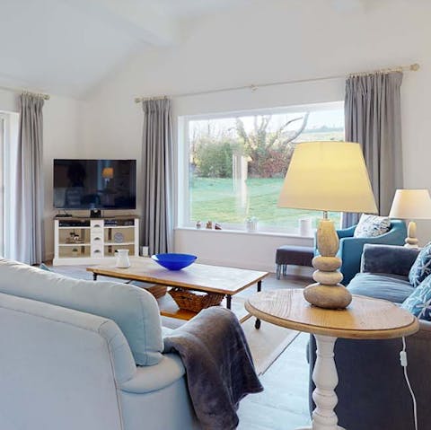 Relax in the cosy lounge and enjoy views of the gardens