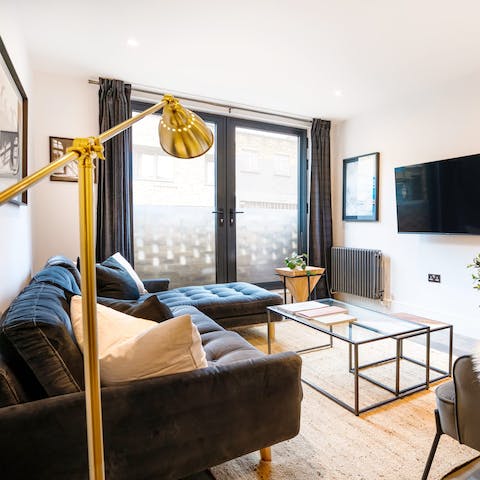Kick back in the bright living room with a glass of wine after a day of London sightseeing