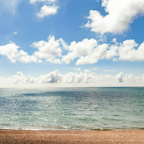 Enjoy ice cream on the beach right in front of this home