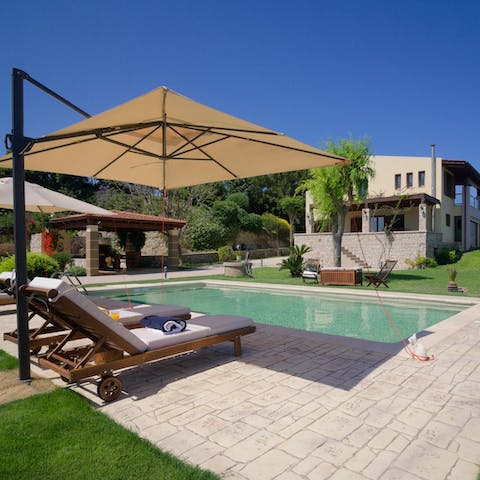 Take a refreshing dip in the sparkling swimming pool