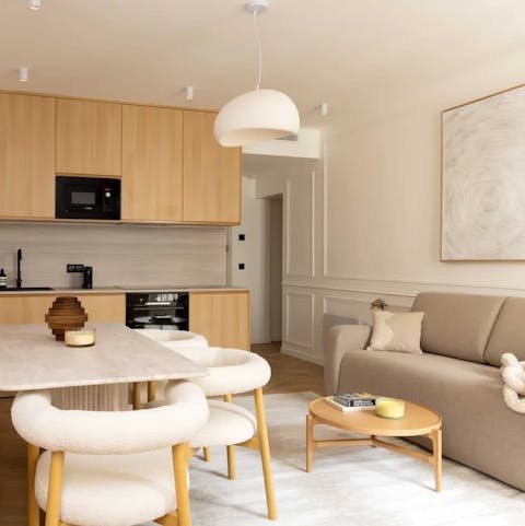 Have a glass of French wine in the open-plan living room after a busy day in Paris
