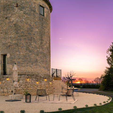 Sip a glass of locally produced wine as you watch the sunset