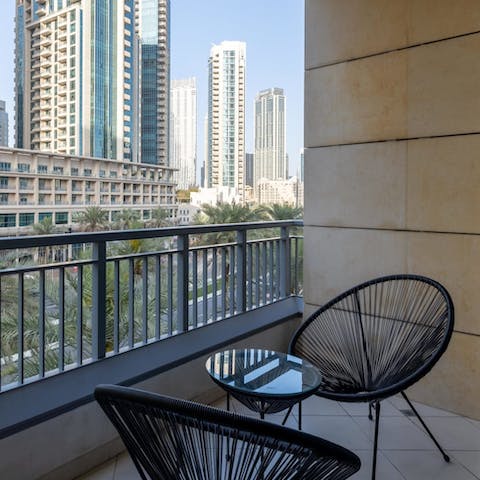 Savour your morning coffee on the balcony, looking out to the gorgeous vista of skyscrapers, palm trees, and blue skies