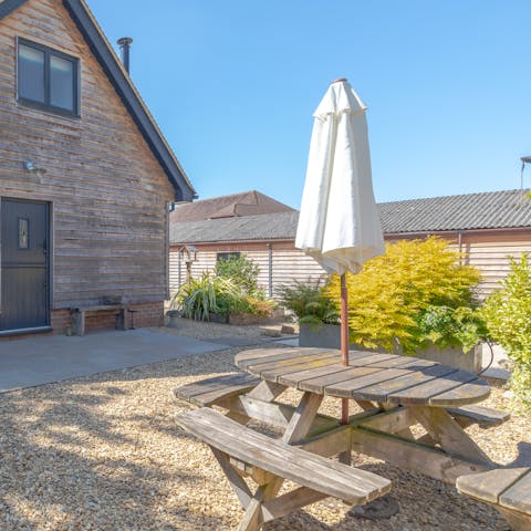 Enjoy al fresco meals at the table in the sunny courtyard 