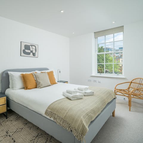 Wake up in sunny bedrooms after a sound sleep in plush beds