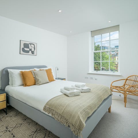 Wake up in sunny bedrooms after a sound sleep in plush beds