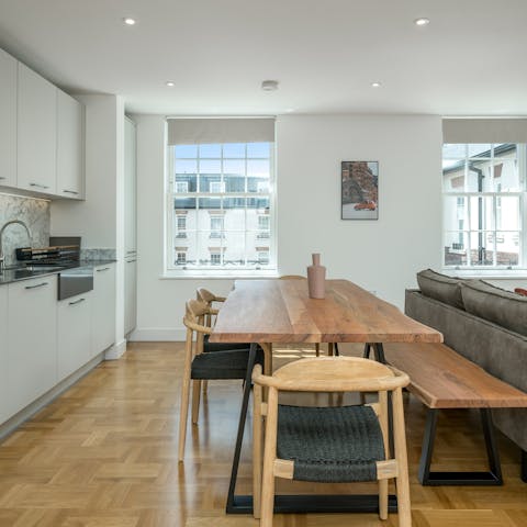 Gather at the raw wood dining table for group meals