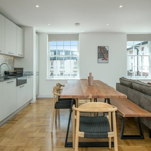Gather at the raw wood dining table for group meals